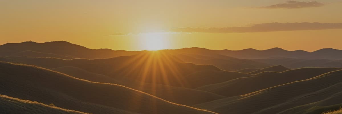 Panoramic sunset view of Edwards Plateau Texas Hill Country landscape with rolling hills and golden light